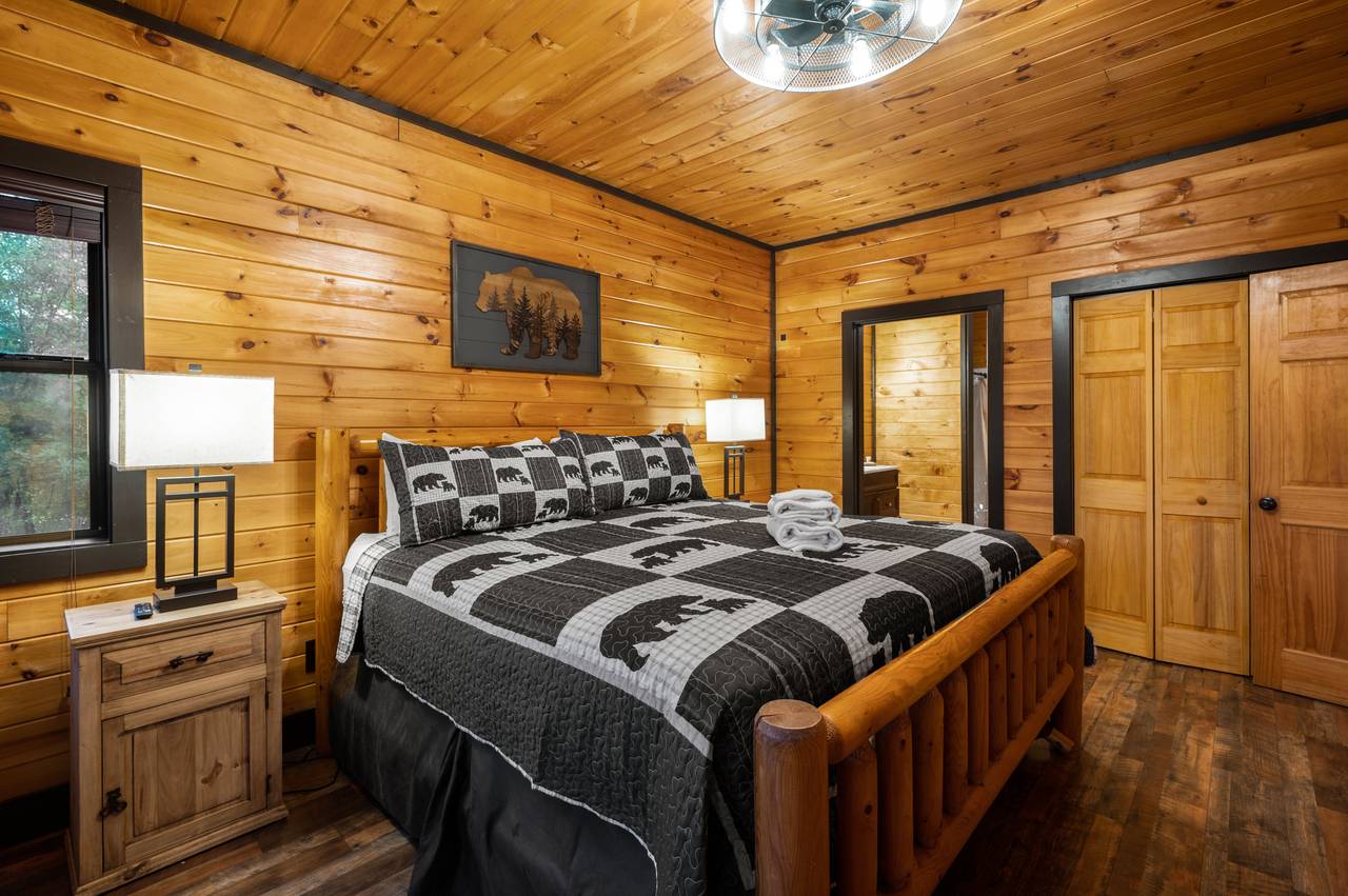 Bed 2: mid-level king w/TV, deck access, & ensuite full bath Bed 2: mid-level king w/TV, deck access, & ensuite full bath