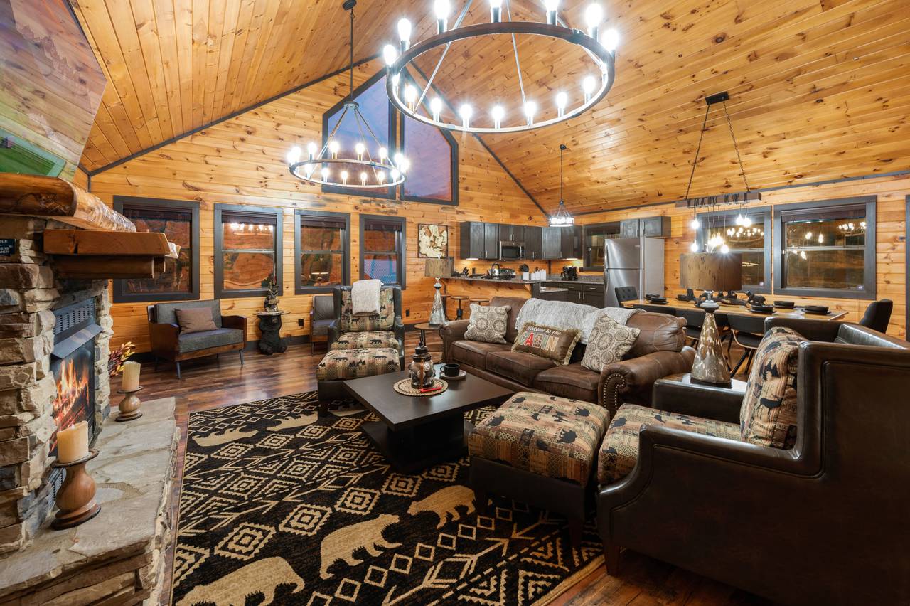 Living room on entry level with sleeper sofa, fireplace, & TV Living room on entry level with sleeper sofa, fireplace, & TV