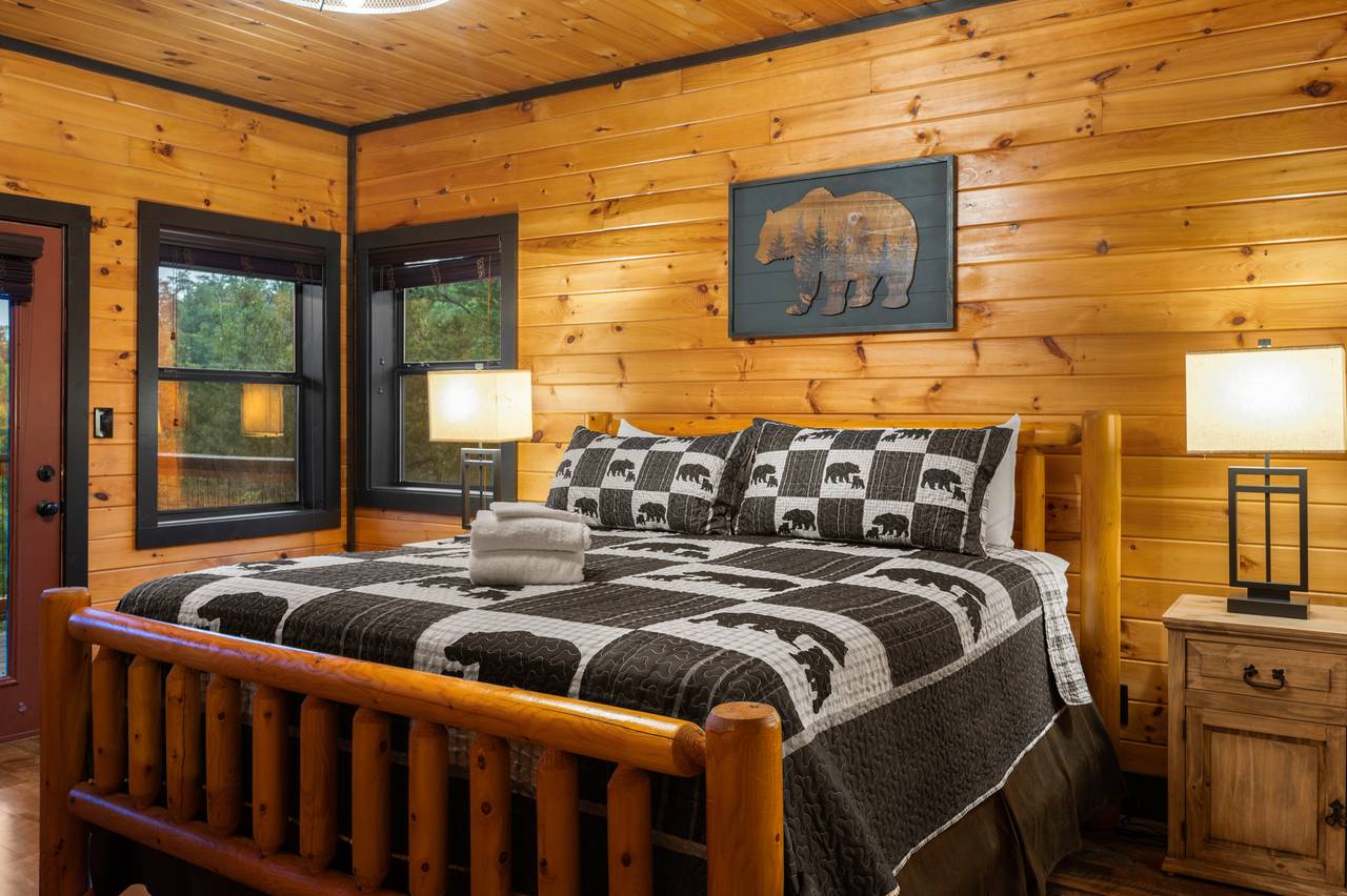Bed 2: mid-level king w/TV, deck access, & ensuite full bath Bed 2: mid-level king w/TV, deck access, & ensuite full bath