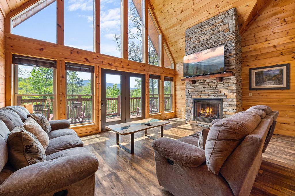 Living room with plush sofas, fireplace, and TV Living room with plush sofas, fireplace, and TV