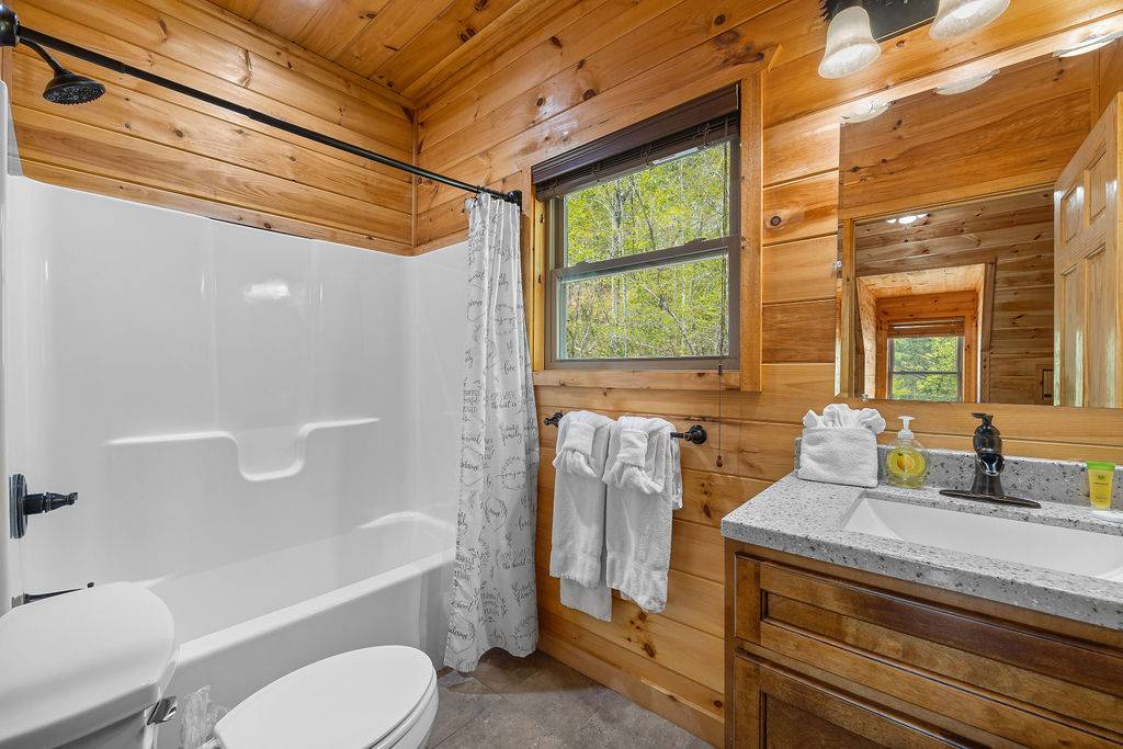 Upper level king ensuite bathroom with tub shower combo Upper level king ensuite bathroom with tub shower combo