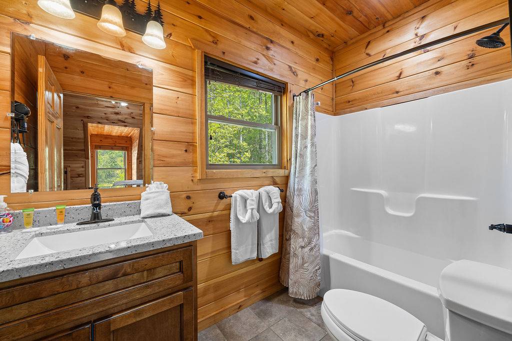 Upper level king ensuite bathroom with tub shower combo Upper level king ensuite bathroom with tub shower combo