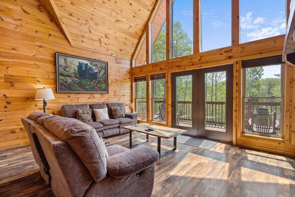 Living room with plush sofas, fireplace, and TV Living room with plush sofas, fireplace, and TV