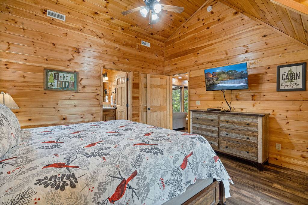 King bedroom with TV and ensuite full bathroom King bedroom with TV and ensuite full bathroom
