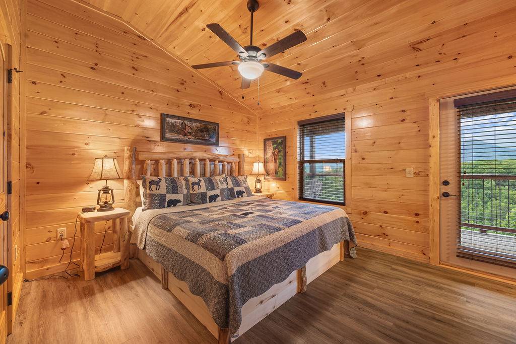 Upper level king bedroom w/deck access, TV, & ensuite bath
