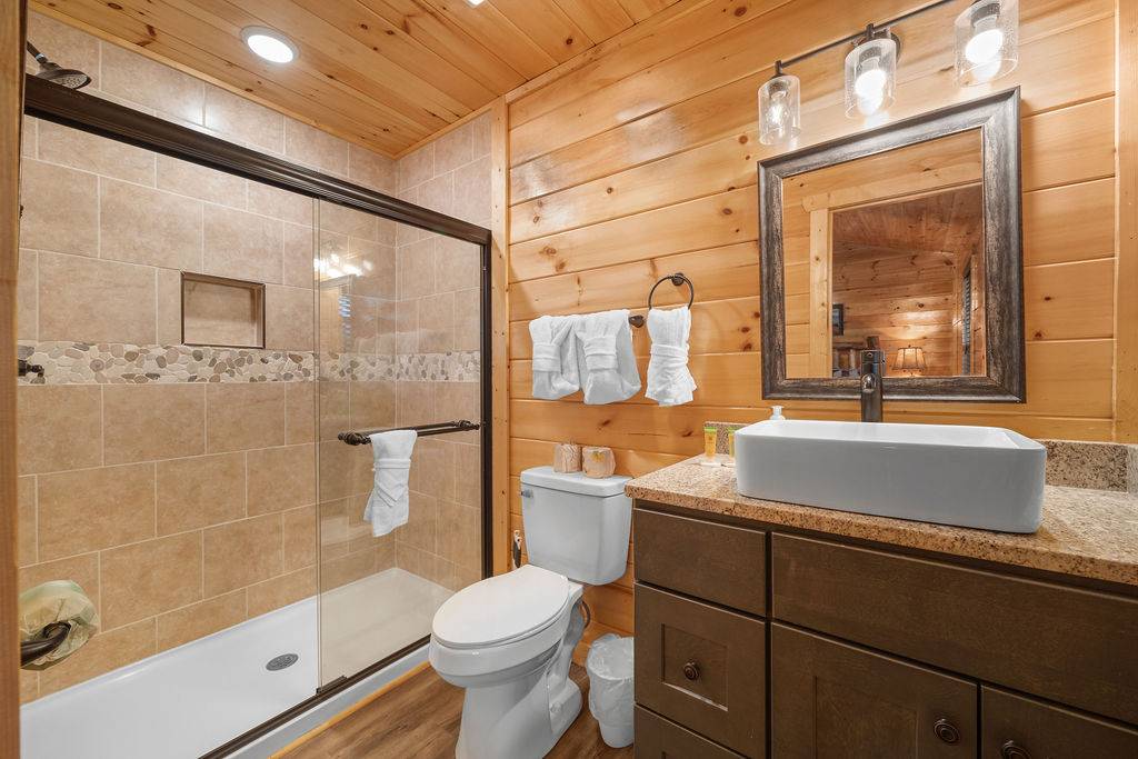 Upper level king ensuite full bathr with standing shower