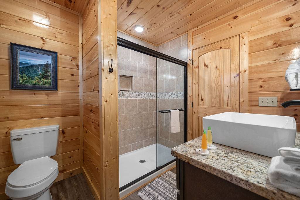 Entry level king ensuite full bathroom with standing shower