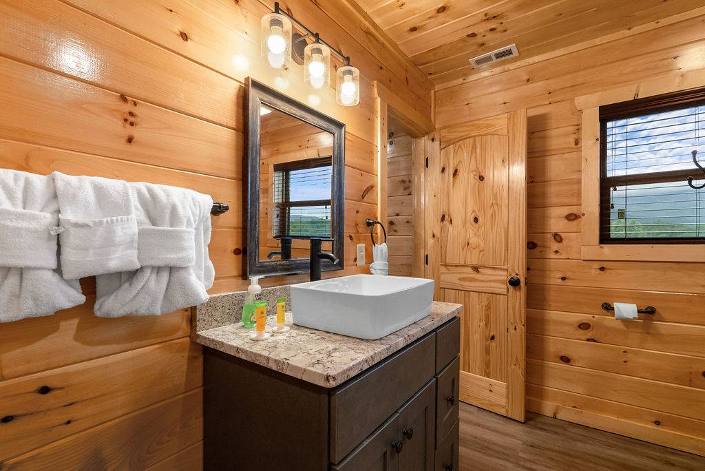 Entry level king ensuite full bathroom with standing shower