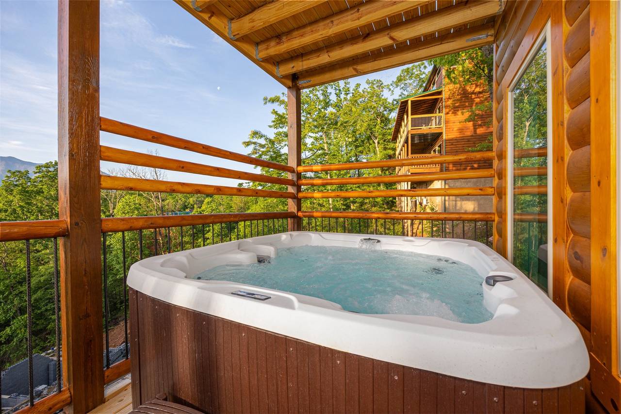 Relax in the hot tub beneath wide-open mountain views Relax in the hot tub beneath wide-open mountain views