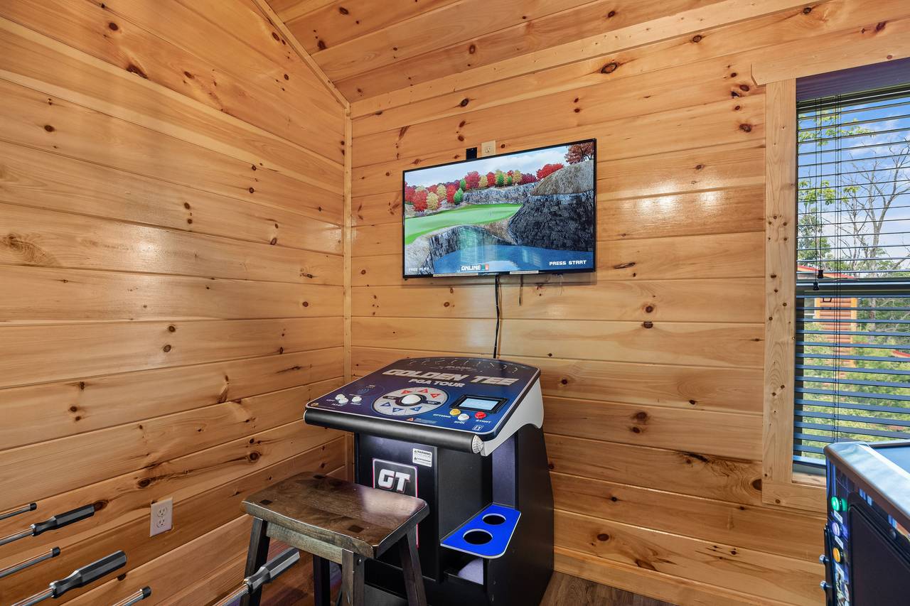 Golden Tee arcade game in the cabin game room Golden Tee arcade game in the cabin game room