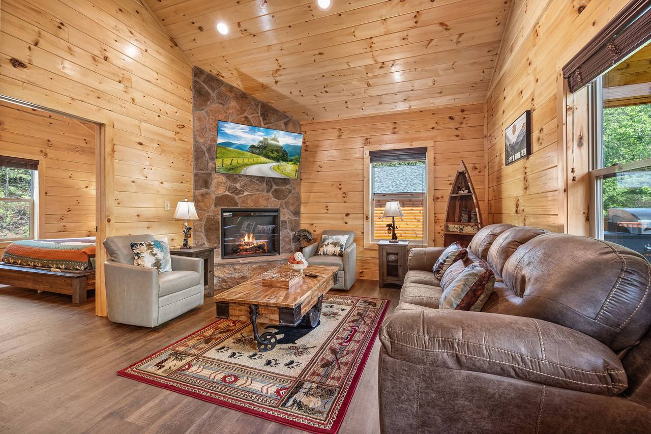 Living room with sleeper sofa, TV, and fireplace! Living room with sleeper sofa, TV, and fireplace!