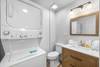 Lower level half bath with stackable washer and dryer Lower level half bath with stackable washer and dryer