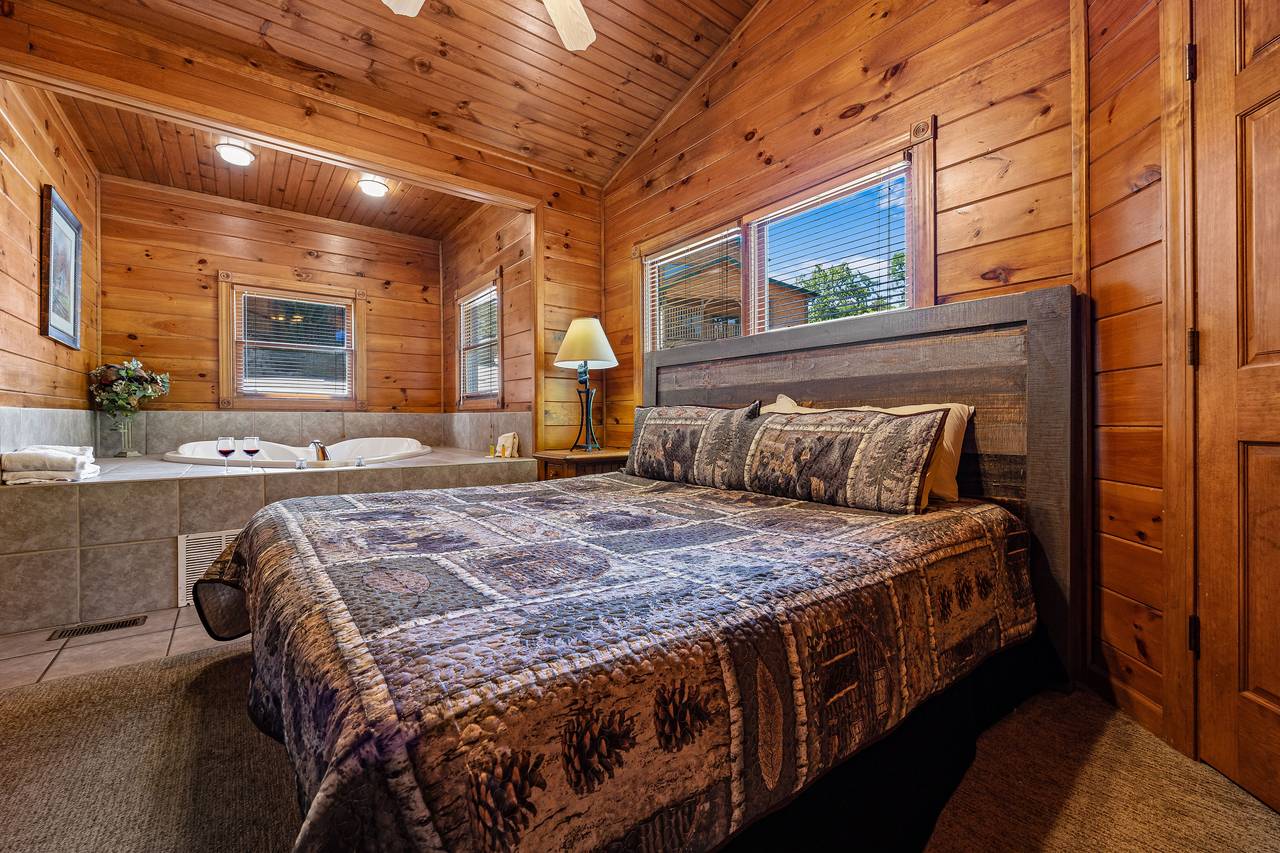 King bedroom with TV, fireplace, & heart shaped jacuzzi tub. King bedroom with TV, fireplace, & heart shaped jacuzzi tub.