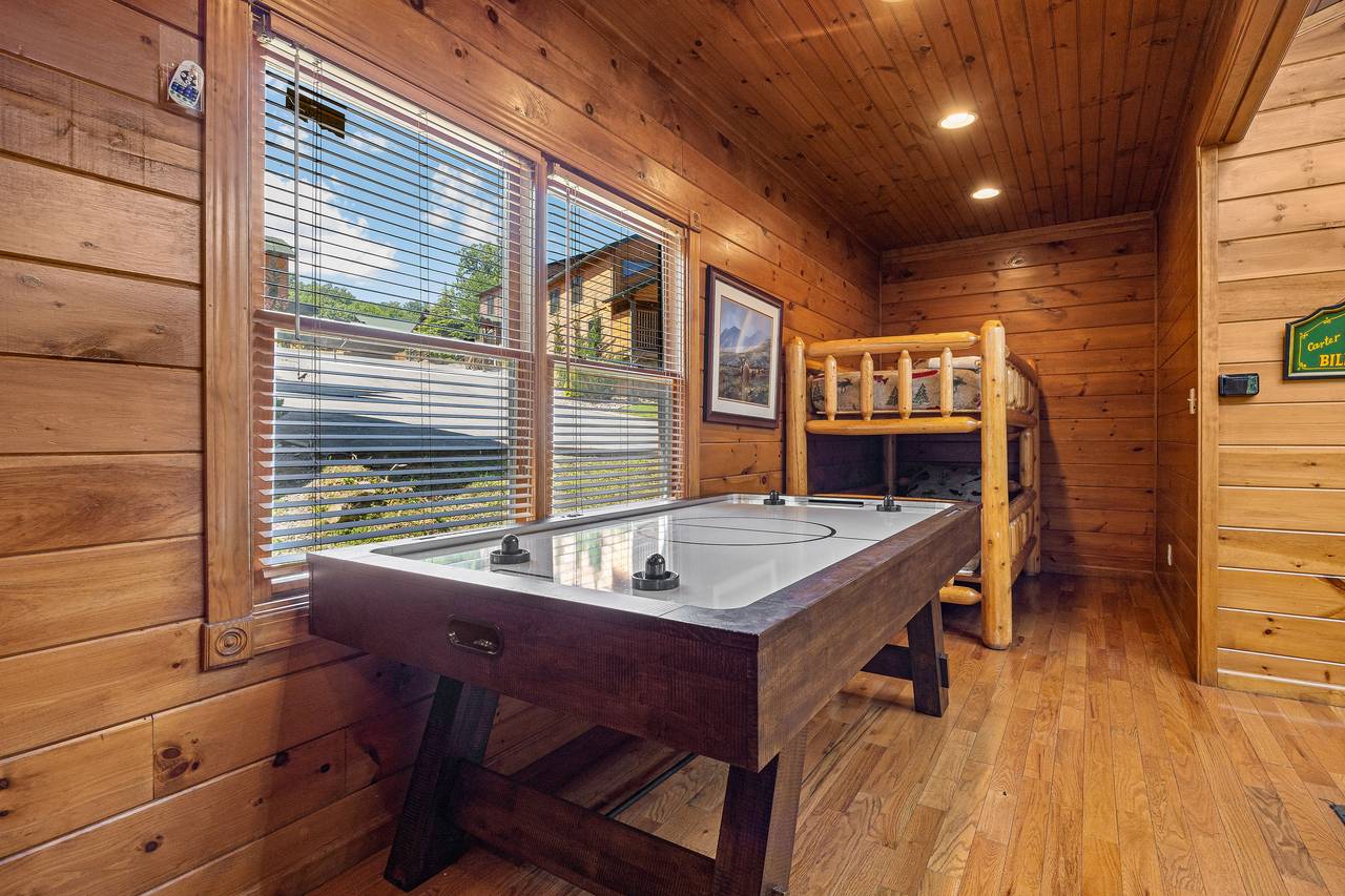 Game room with pool table, multi-cade, and air hockey. Game room with pool table, multi-cade, and air hockey.