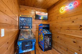 Game room with pool table, pinball, multi-cade, & air hockey. Game room with pool table, pinball, multi-cade, & air hockey.