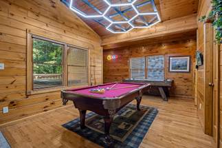 Game room with pool table, pinball, multi-cade, & air hockey. Game room with pool table, pinball, multi-cade, & air hockey.