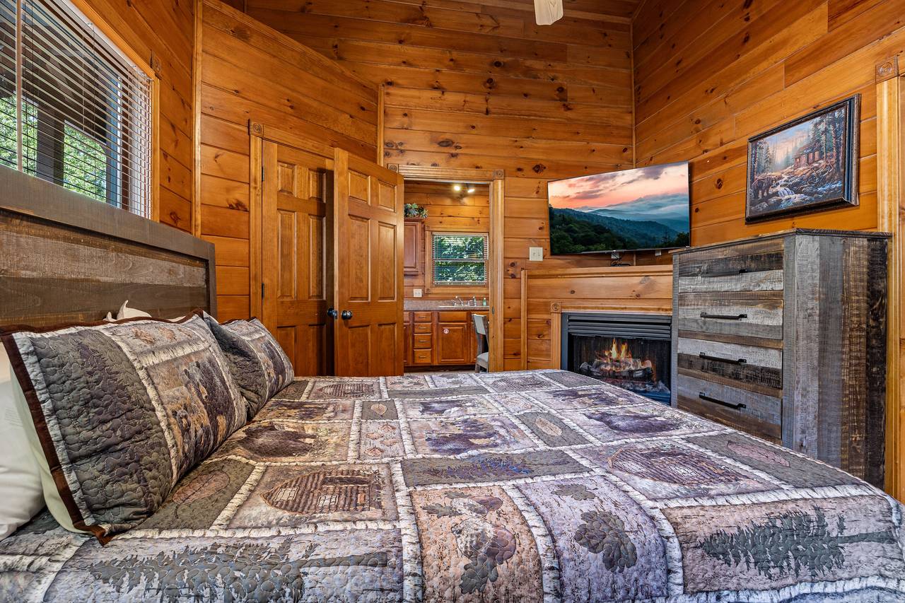 King bedroom with TV, fireplace, & heart shaped jacuzzi tub. King bedroom with TV, fireplace, & heart shaped jacuzzi tub.