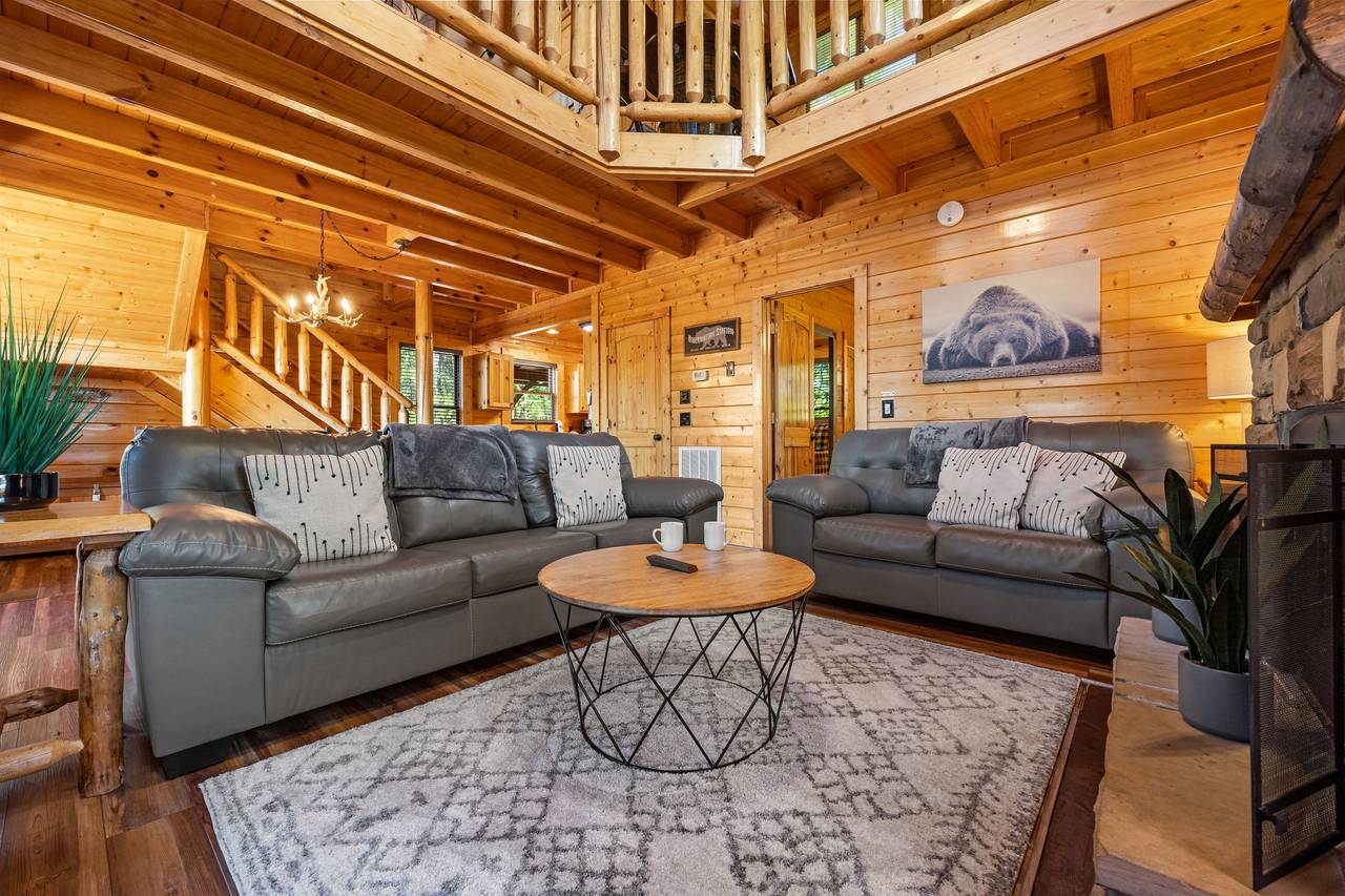 Spacious living room with sleeper sofa, fireplace, & TV Spacious living room with sleeper sofa, fireplace, & TV
