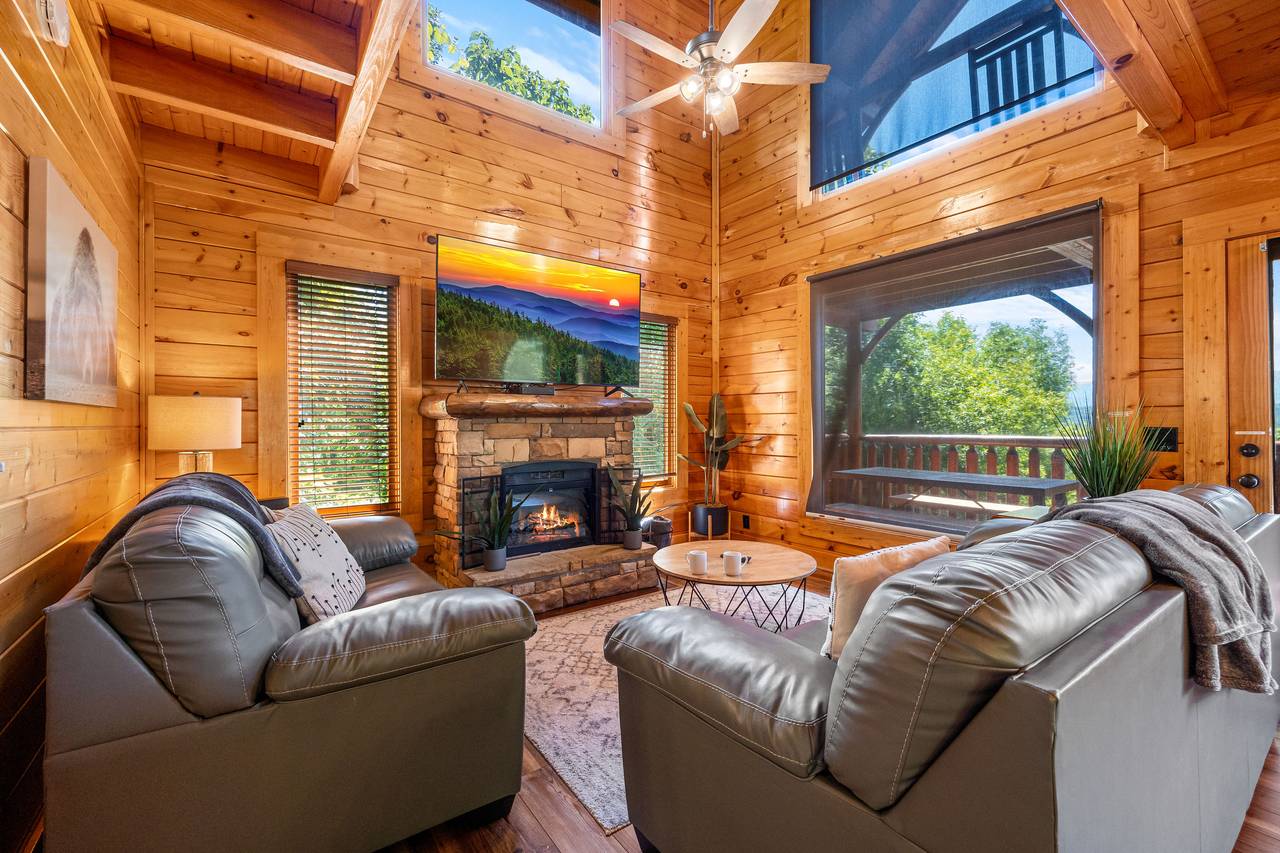 Spacious living room with sleeper sofa, fireplace, & TV Spacious living room with sleeper sofa, fireplace, & TV