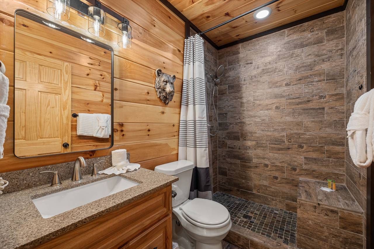 Entry level shared bath with standing shower Entry level shared bath with standing shower