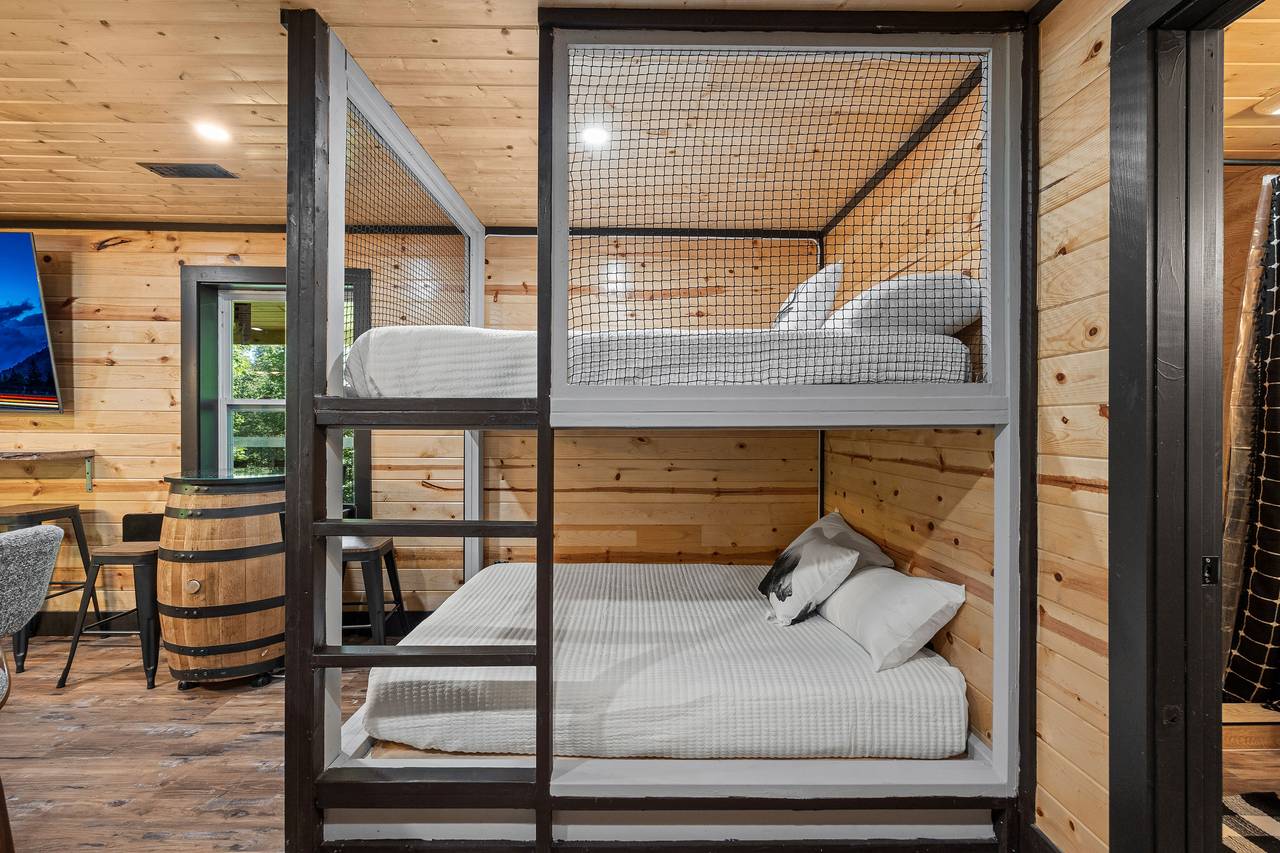 Full over full bunkbed with TV in lower level game room Full over full bunkbed with TV in lower level game room