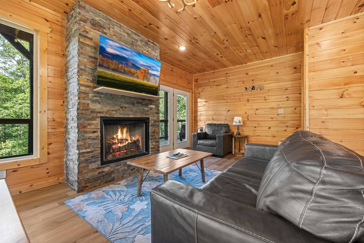 Living room with gas fireplace, TV, and comfy seating! Living room with gas fireplace, TV, and comfy seating!