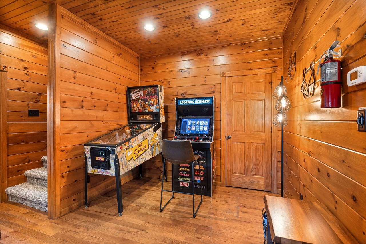 Lower level game room with pool table, pinball, and multi-cade Lower level game room with pool table, pinball, and multi-cade