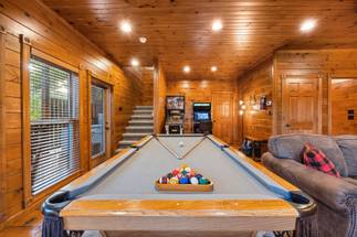 Lower level game room with pool table, pinball, and multi-cade Lower level game room with pool table, pinball, and multi-cade