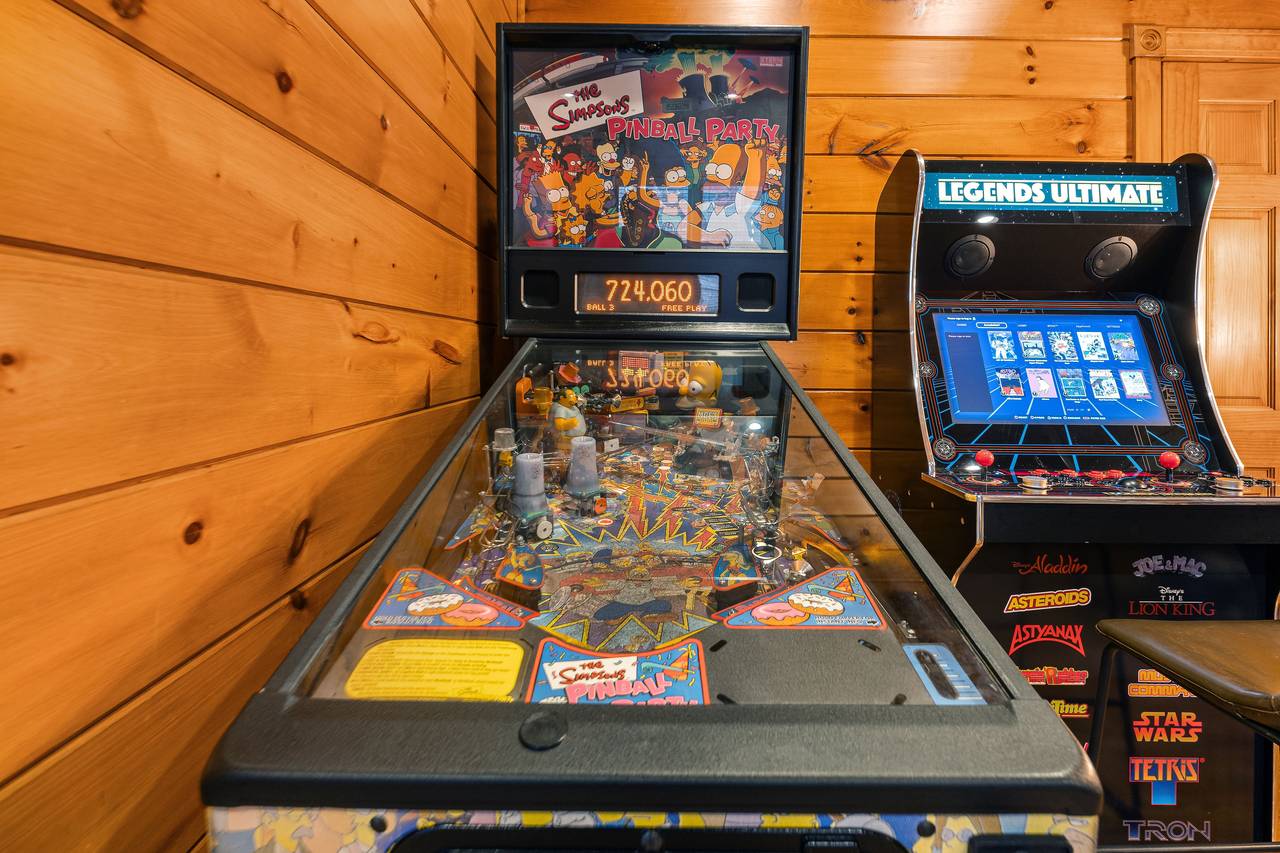 Lower level game room with pool table, pinball, and multi-cade Lower level game room with pool table, pinball, and multi-cade
