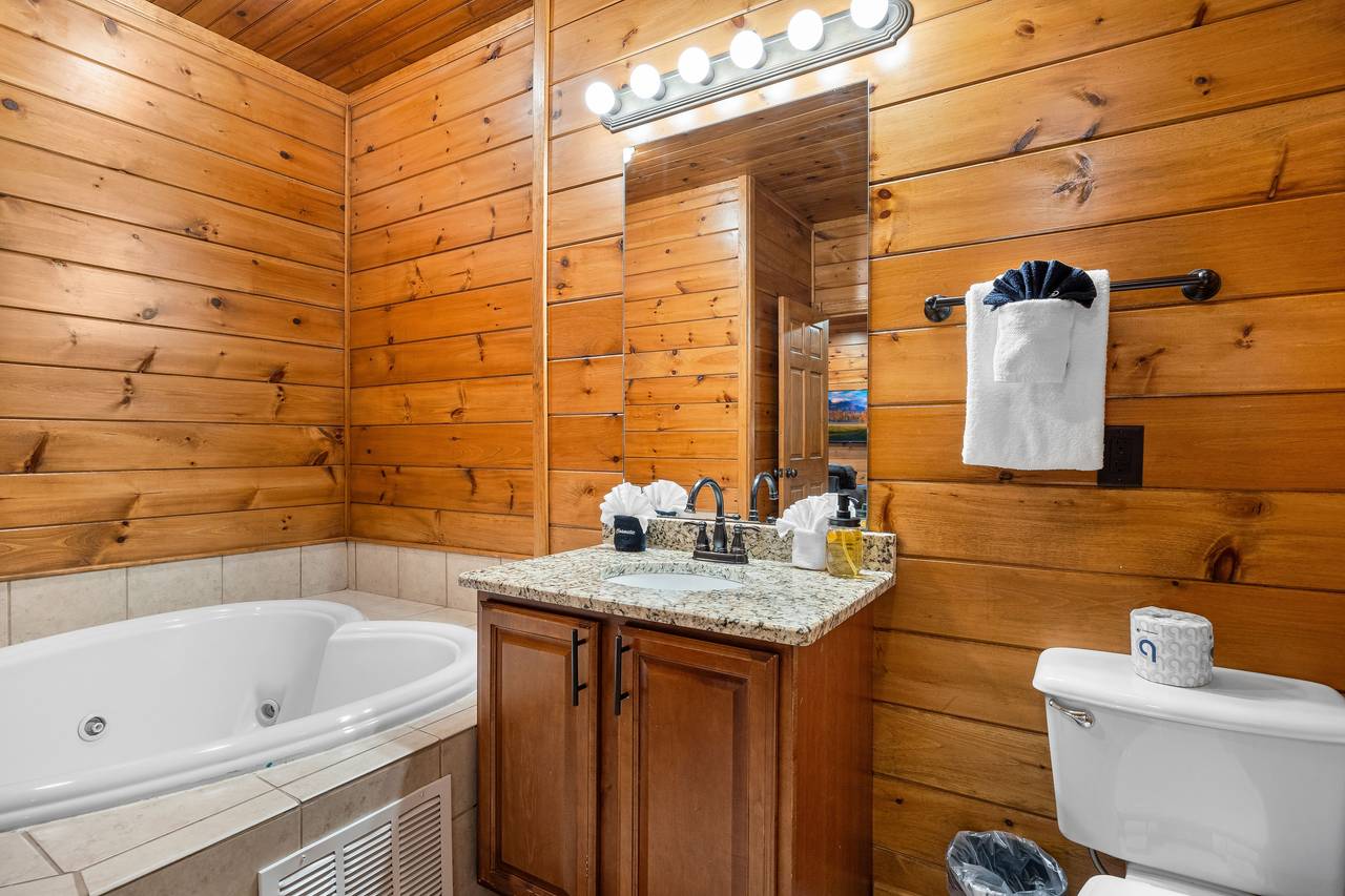 Lower level bathroom w/tanding shower & heart shaped jacuzzi Lower level bathroom w/tanding shower & heart shaped jacuzzi