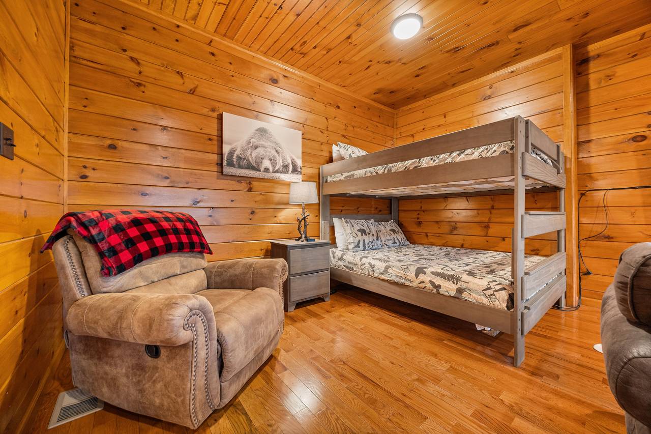 Lower level game room with full over queen bunk bed. Lower level game room with full over queen bunk bed.