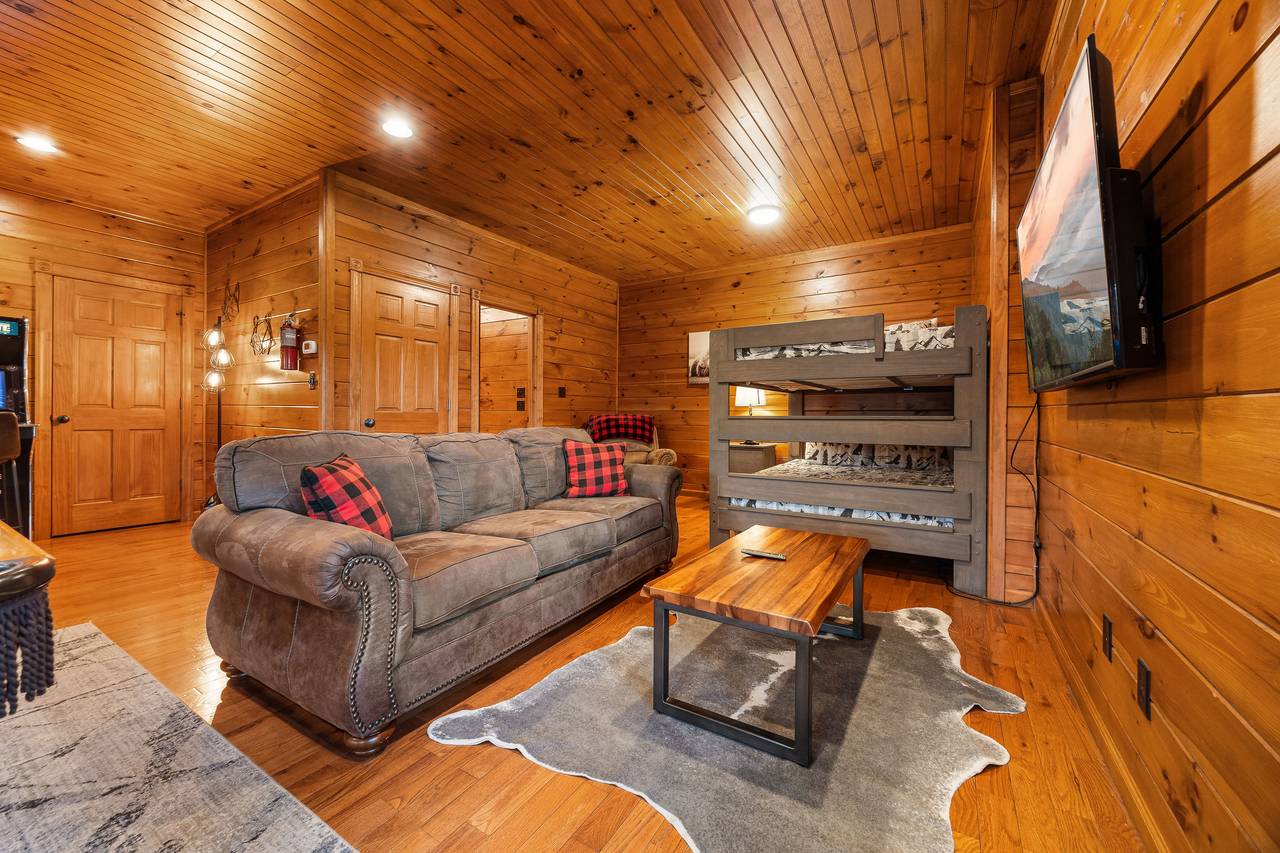 Lower level game room with full over queen bunk bed. Lower level game room with full over queen bunk bed.