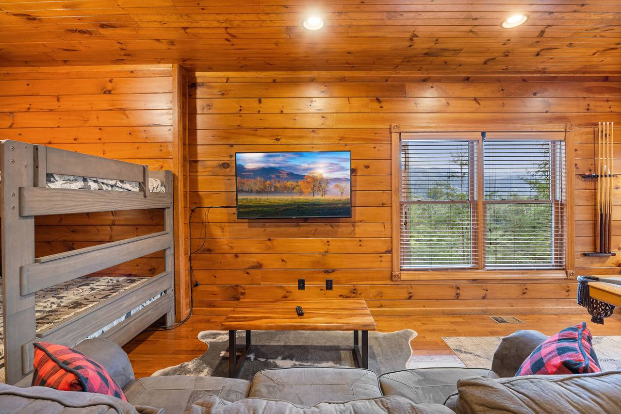 Lower level game room with full over queen bunk bed. Lower level game room with full over queen bunk bed.