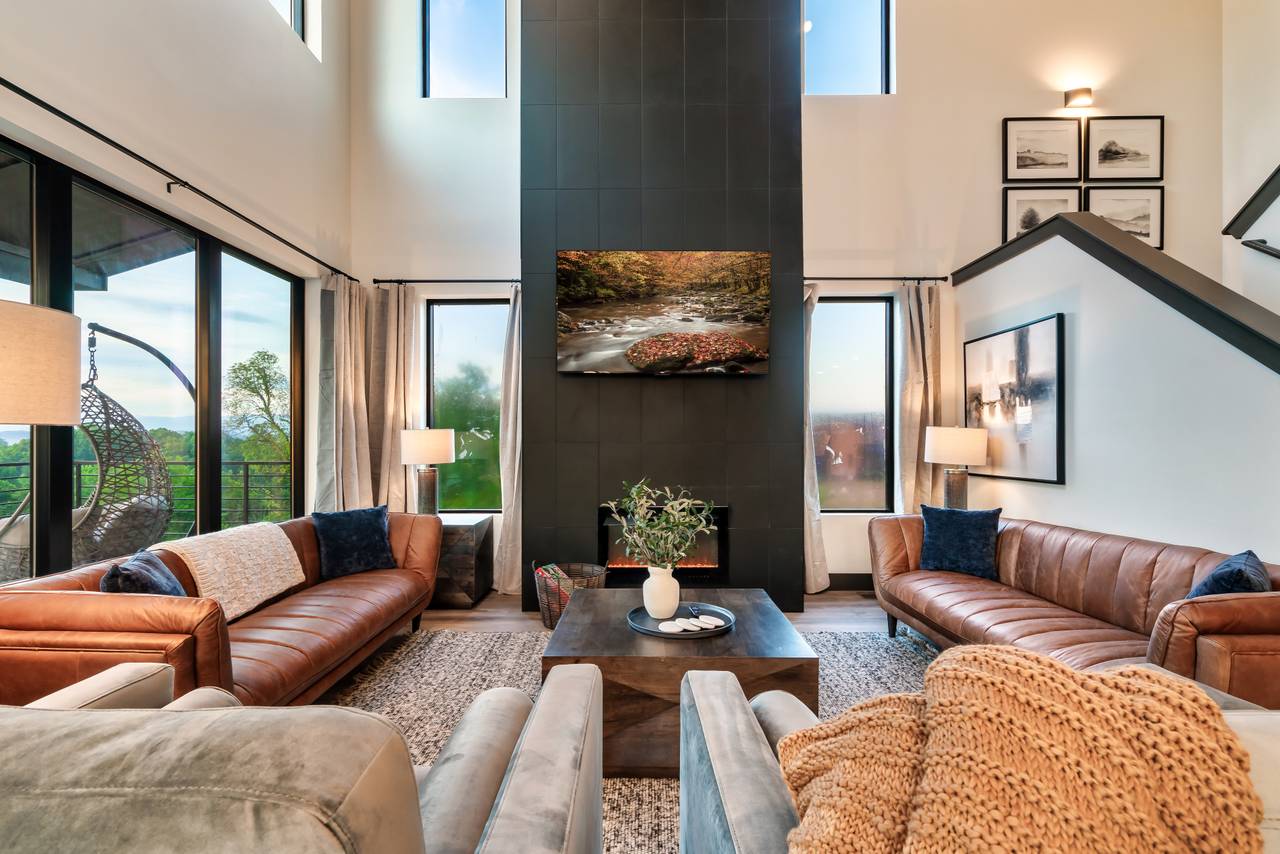 Spacious living room with fireplace, comfy seating, & TV Spacious living room with fireplace, comfy seating, & TV
