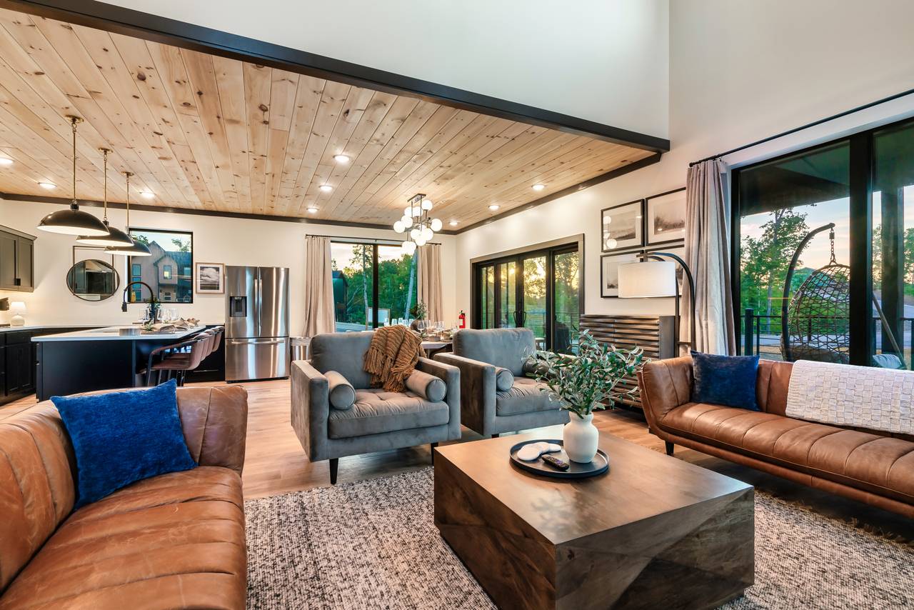 Spacious living room with fireplace, comfy seating, & TV Spacious living room with fireplace, comfy seating, & TV