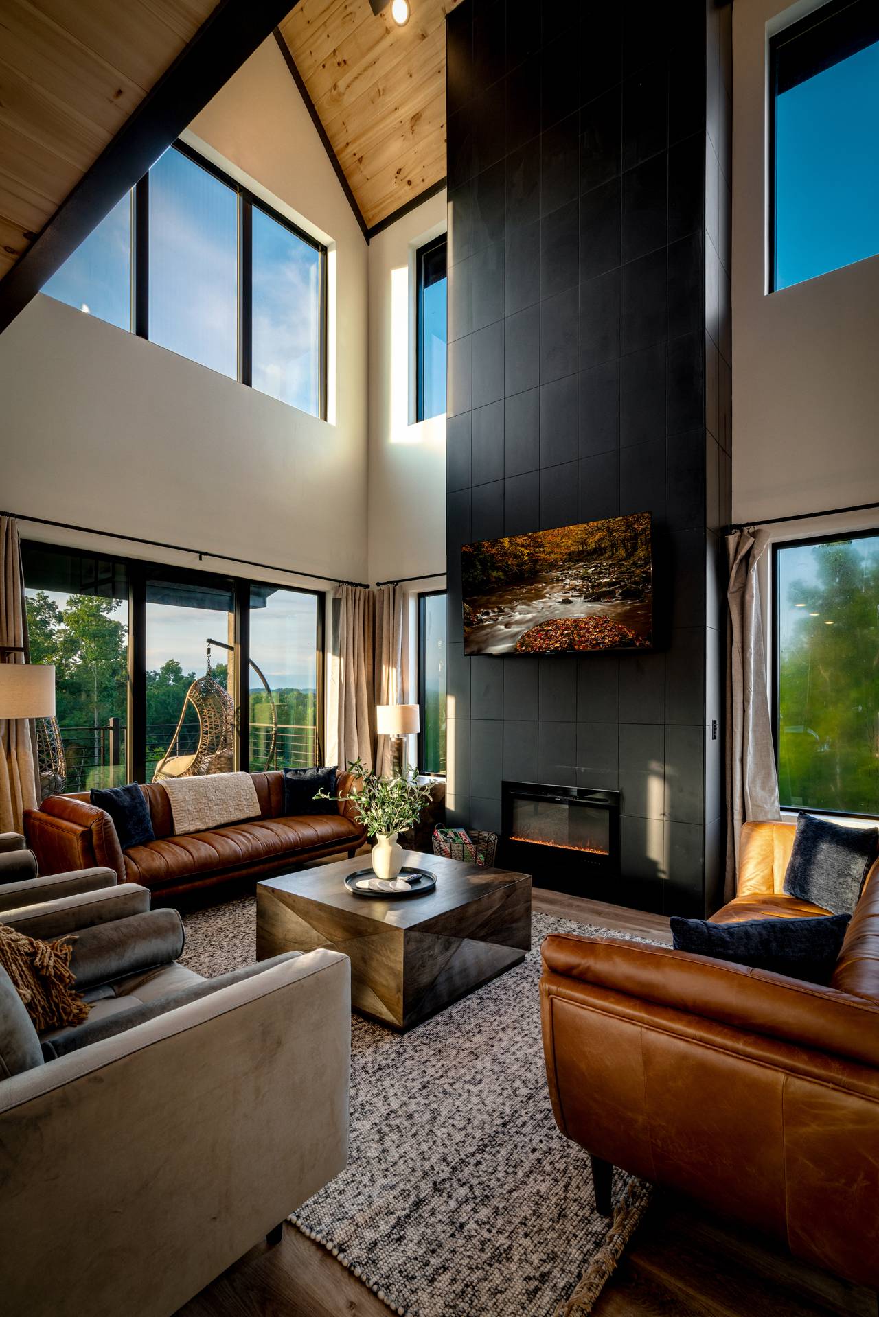 Spacious living room with fireplace, comfy seating, & TV Spacious living room with fireplace, comfy seating, & TV