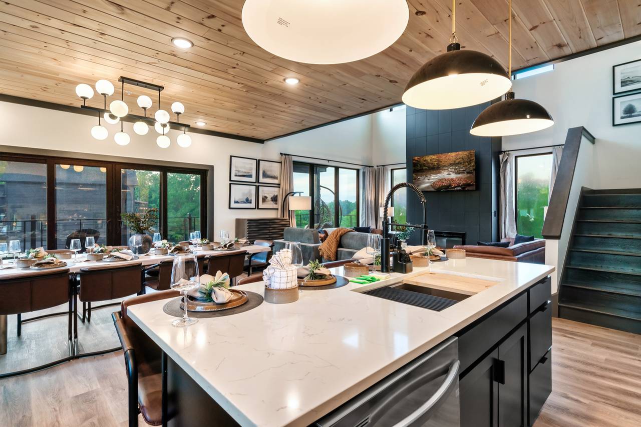Kitchen island with additional space for serving and seating. Kitchen island with additional space for serving and seating.