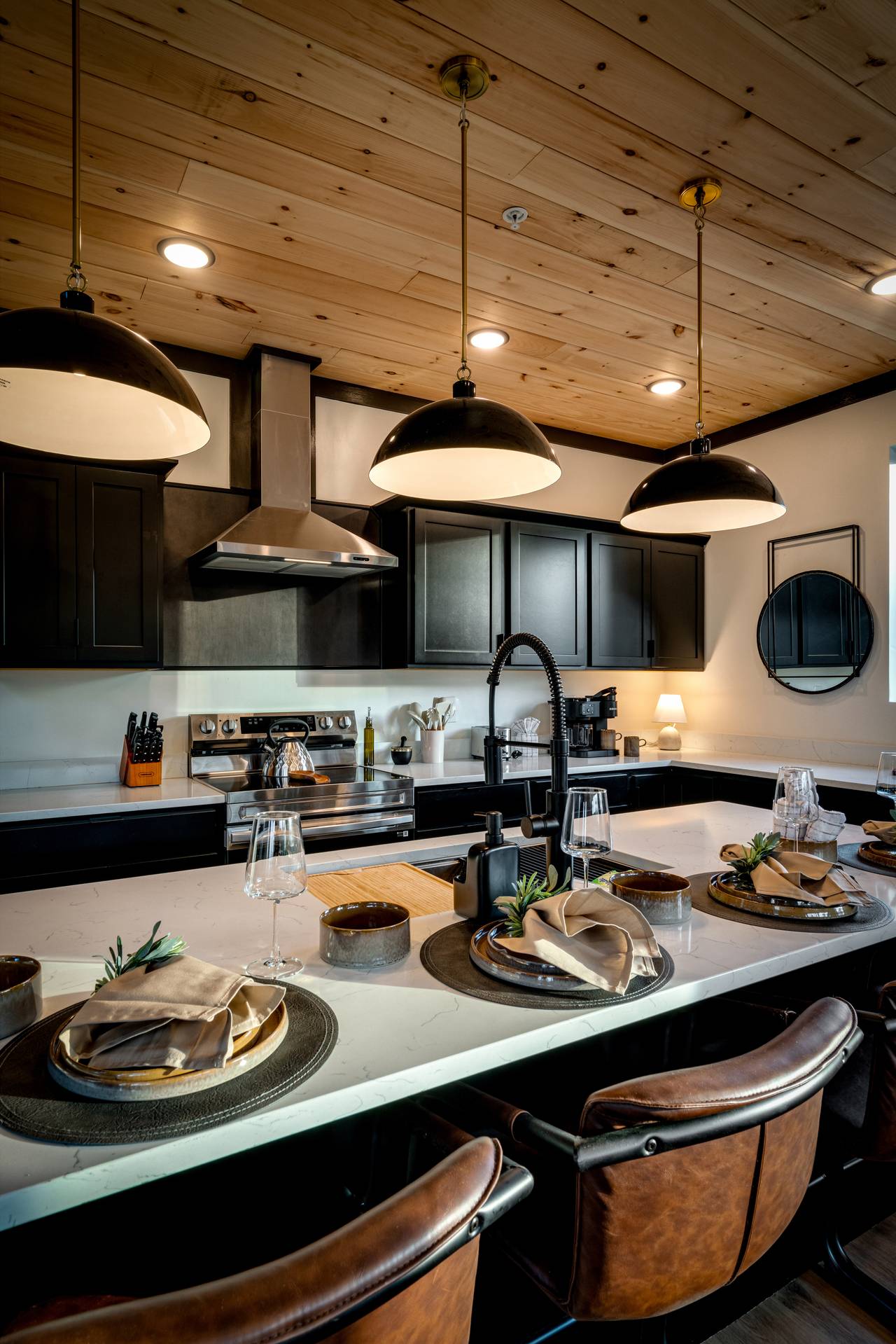 Kitchen island with additional space for serving and seating. Kitchen island with additional space for serving and seating.