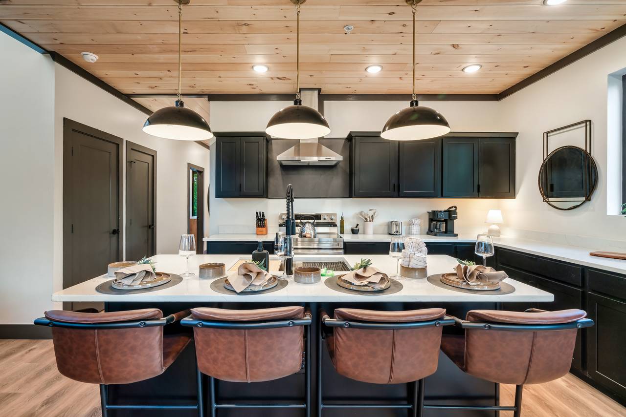 Kitchen island with additional space for serving and seating. Kitchen island with additional space for serving and seating.
