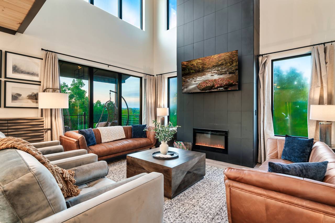 Spacious living room with fireplace, comfy seating, & TV Spacious living room with fireplace, comfy seating, & TV