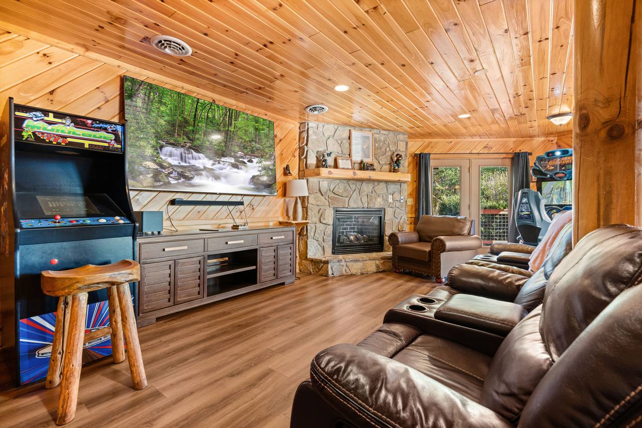 Theater-style recliners facing a large screen TV Theater-style recliners facing a large screen TV