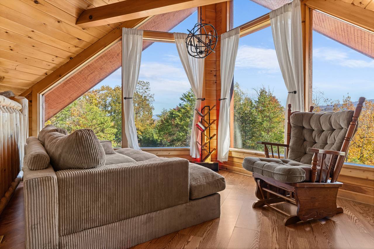 Cozy loft with rocking chair, couch & comfy loveseat seating Cozy loft with rocking chair, couch & comfy loveseat seating