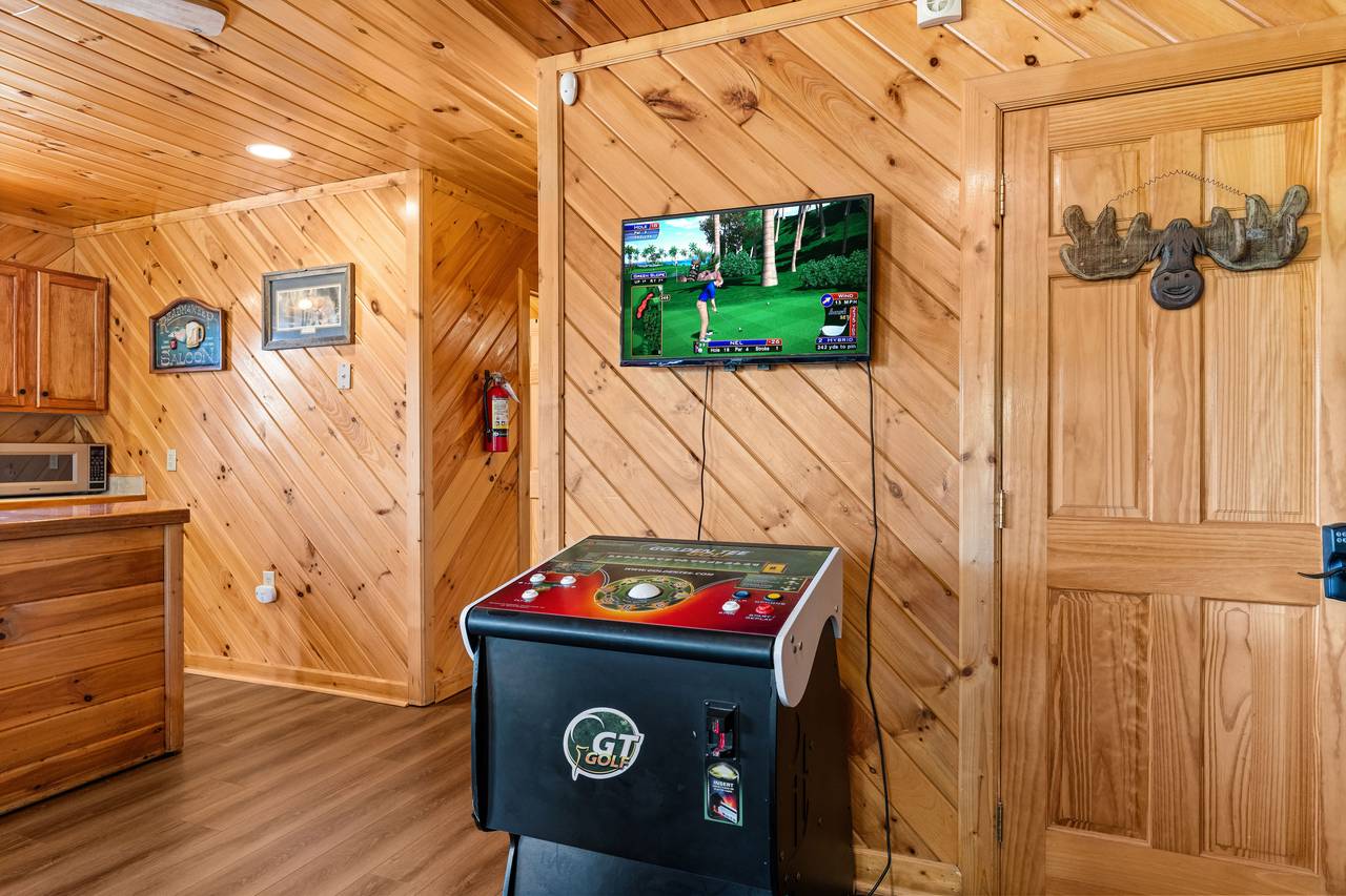 Lower level game room with Golden Tee Lower level game room with Golden Tee