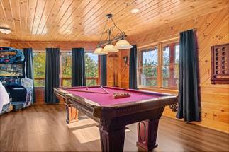 Game room w/ pool table, arcades, bar & lounge seating Game room w/ pool table, arcades, bar & lounge seating