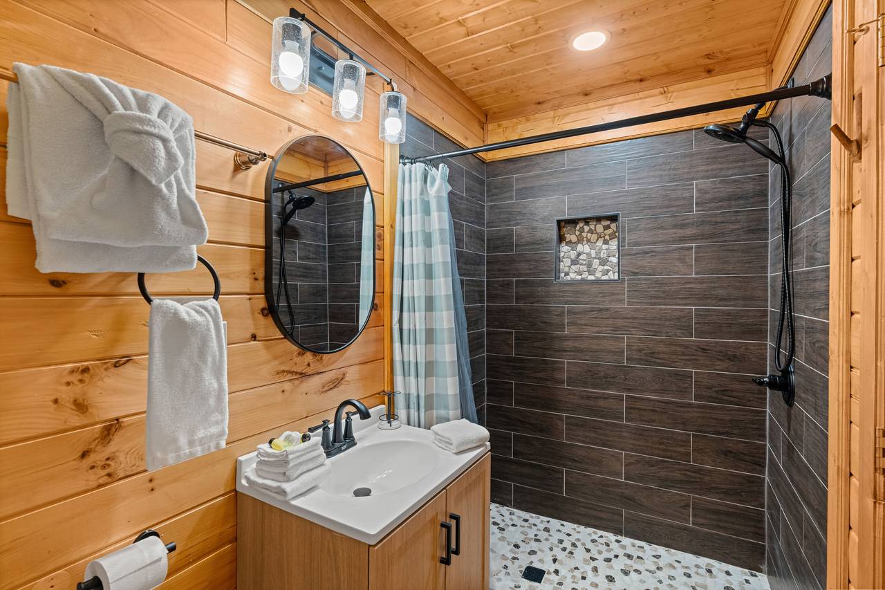 Upper ensuite bath featuring a standing shower Upper ensuite bath featuring a standing shower