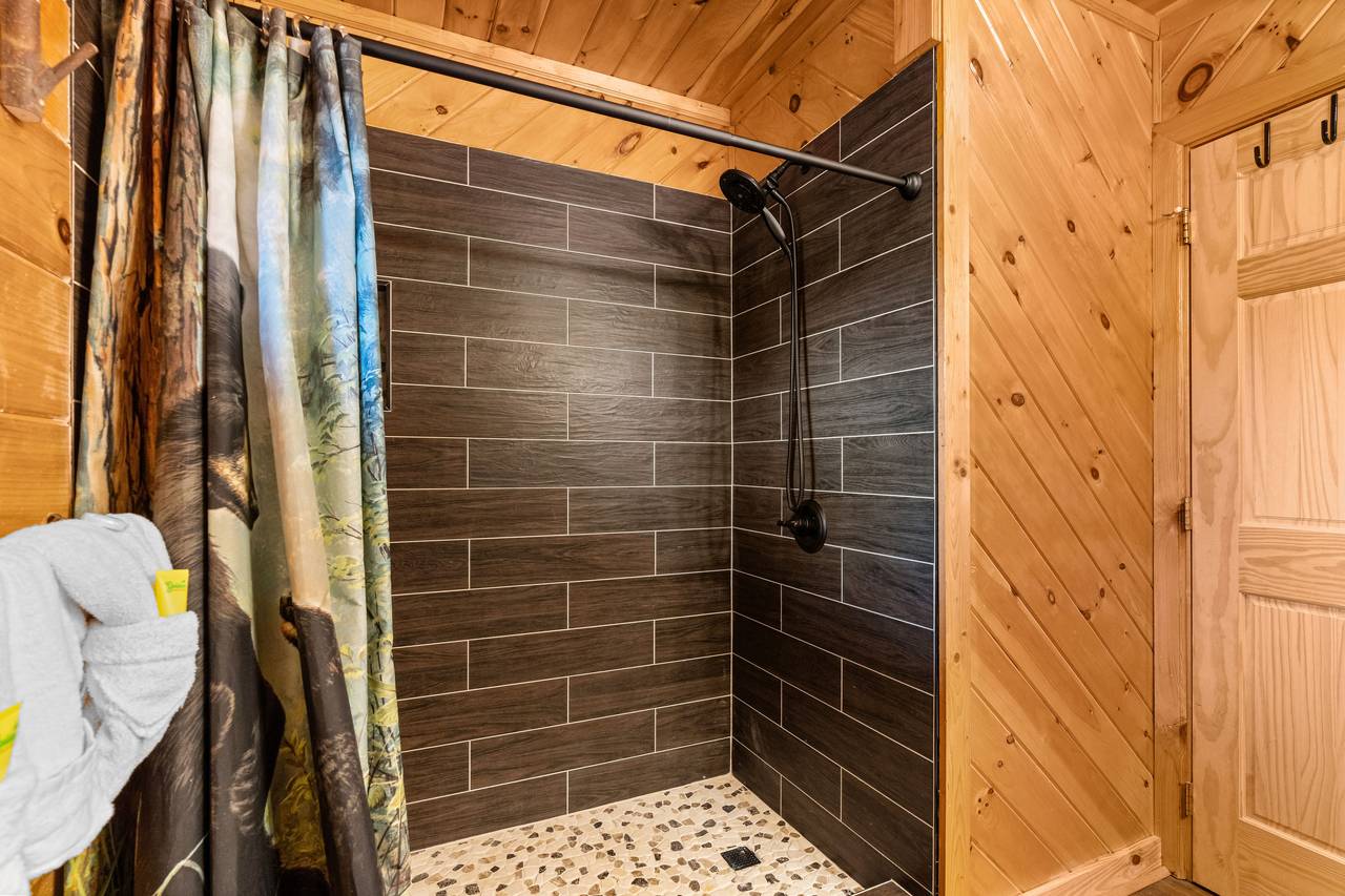 Lower level shared bath w/ walk-in shower Lower level shared bath w/ walk-in shower