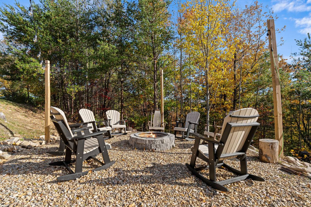 Wood fire-pit surrounded by seating for cozy evenings Wood fire-pit surrounded by seating for cozy evenings