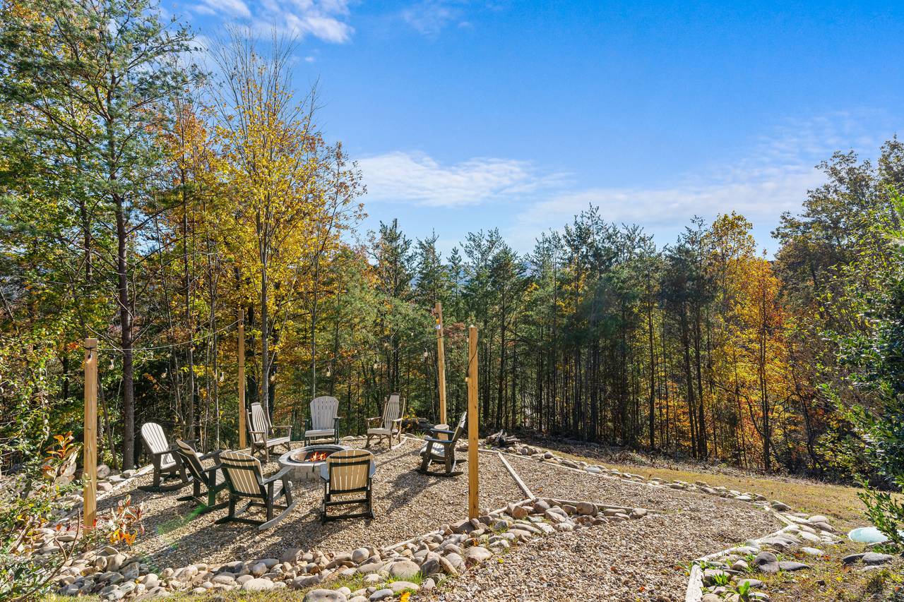 Wood fire-pit surrounded by seating for cozy evenings Wood fire-pit surrounded by seating for cozy evenings