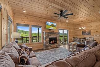 Spacious living room with queen sleeper sofa, TV, & fireplace Spacious living room with queen sleeper sofa, TV, & fireplace