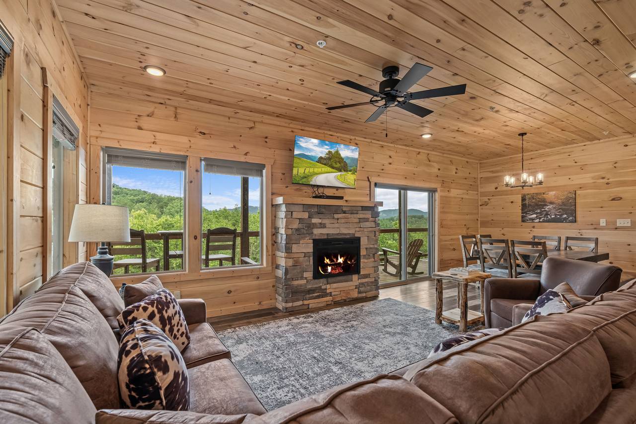 Spacious living room with queen sleeper sofa, TV, & fireplace Spacious living room with queen sleeper sofa, TV, & fireplace